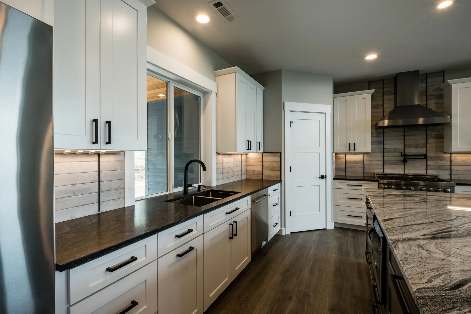 Finished kitchen with cabinets and island seating